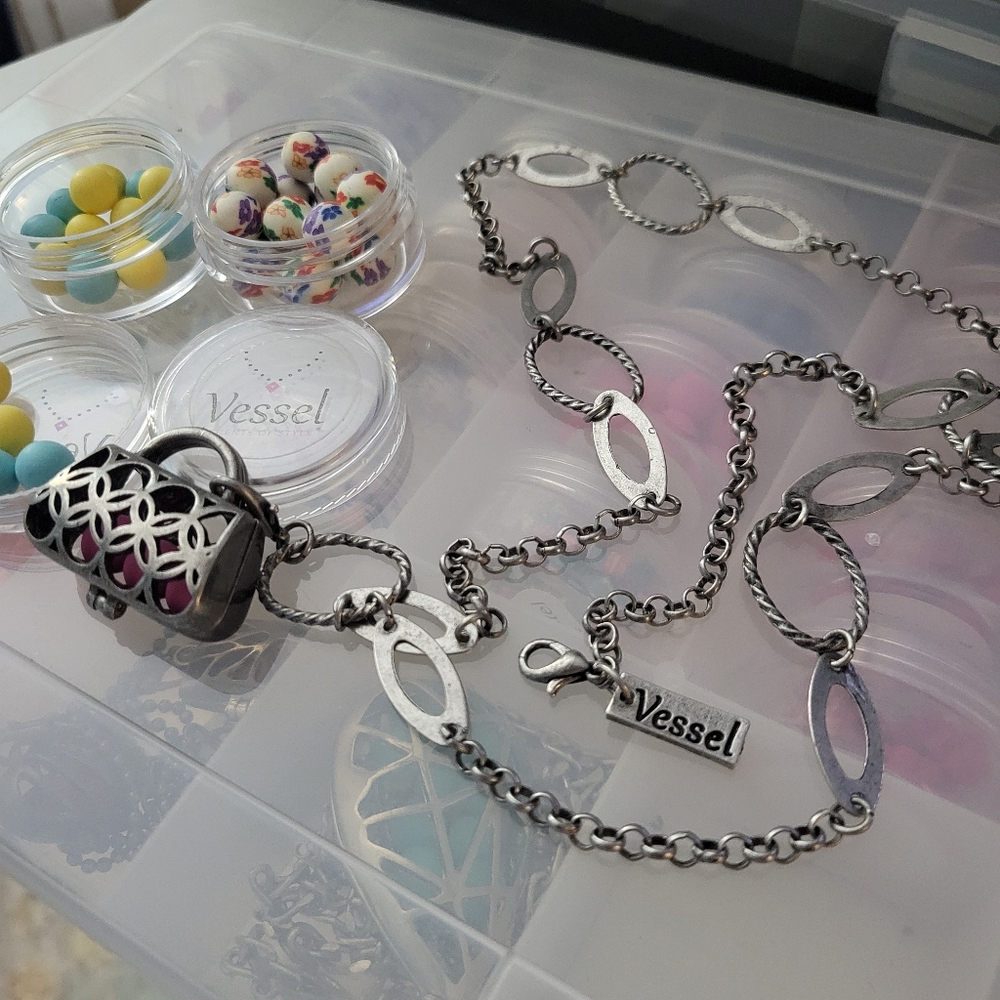 Purse shaped locket holds scented clay beads, Gun Metal chain